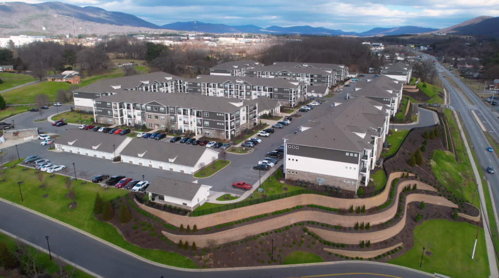 Exterior view of District Vue Apartments featuring modern architectural design with sleek lines, large windows, and landscaped surroundings.